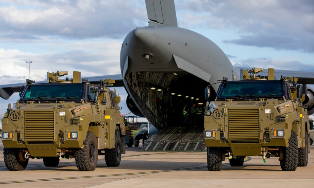 Two Ukraine-bound Bushmaster vehicles wait to be loaded onto a C-17A Globemaster III aircraft at RAAF Base Amberley, near Brisbane. Picture: Emma Schwenke/Royal Australian Air Force via AP