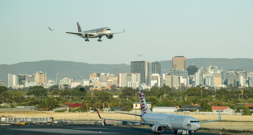 A Qatar Airways flight lands in Adelaide. Photo: AAP/Morgan Sette