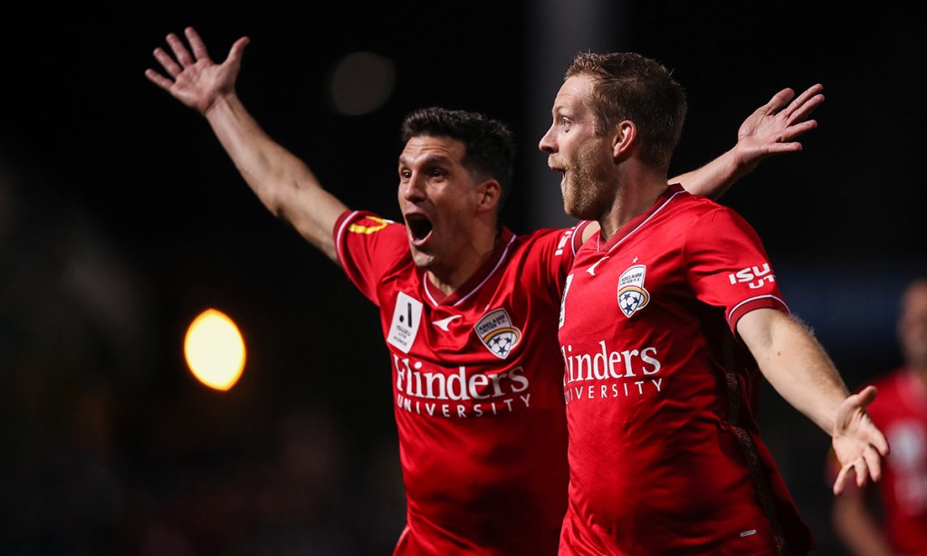 Adelaide's Ryan Kitto and Javi López celebrate a goal during Sunday's win over Western United. Photo: AAP/Matt Turner