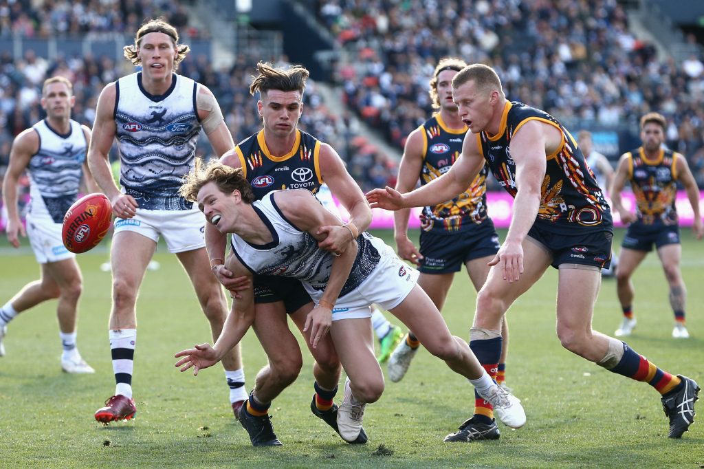 HAIR-RAISING: Keays lays a tackle during Saturday's loss. Photo: Rob Prezioso / AAP