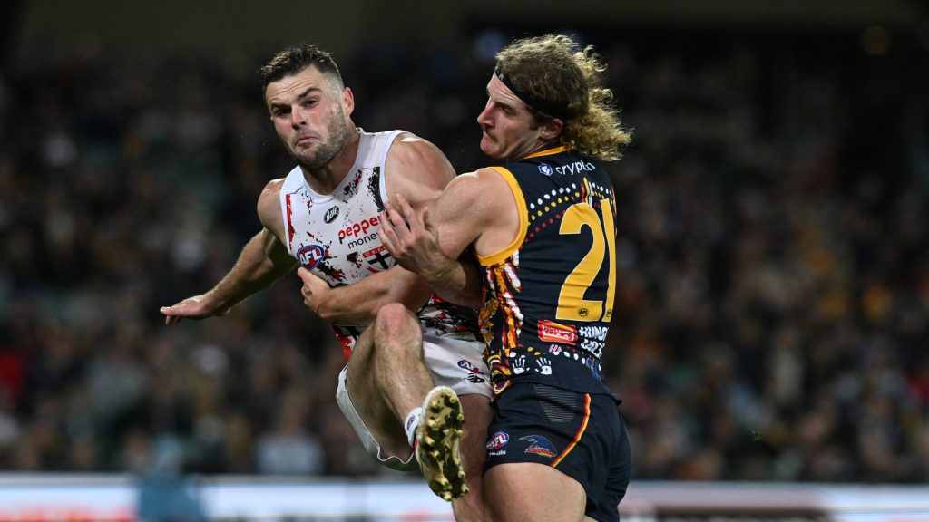 The past meets the future, as Sam Berry tackles the guy whose departure gave Adelaide the draft pick with which they selected him. Crouch got the points this time. Photo: Michael Errey / InDaily