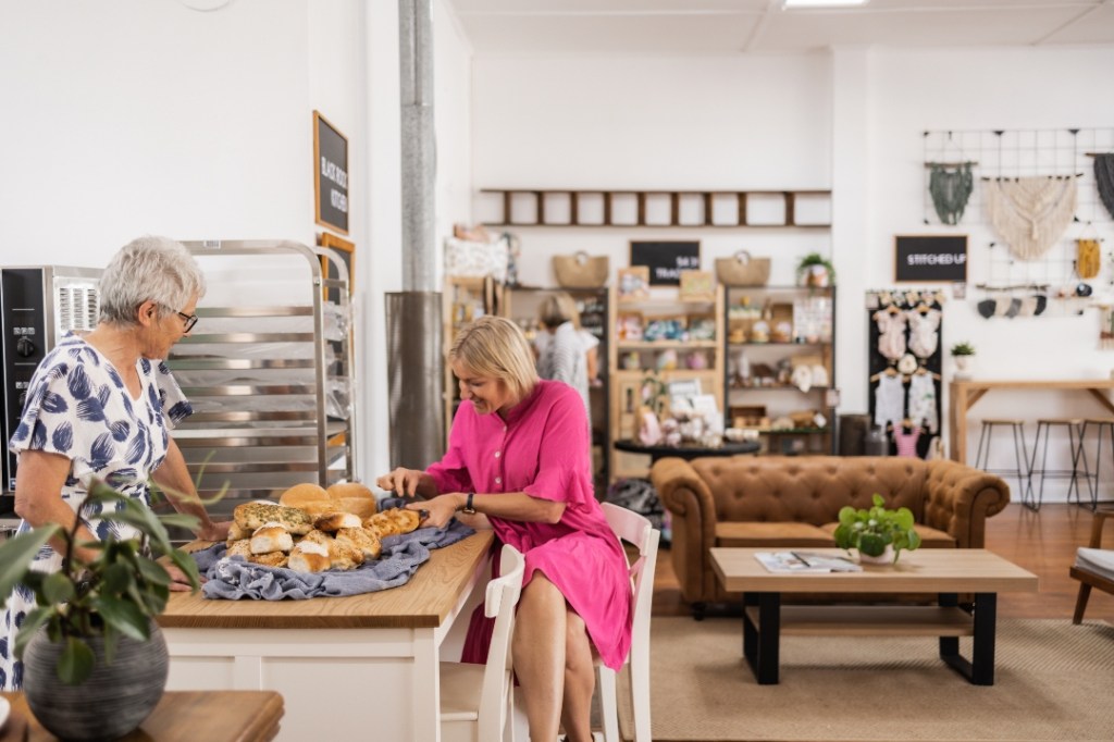 The smell of fresh bread and bakery treats made by Gaye Kuerschner (left) from the Black Rock Kitchen bakery at 5431 Collective is proving irresistible to locals and tourists. Photo: Alysha Sparks.
