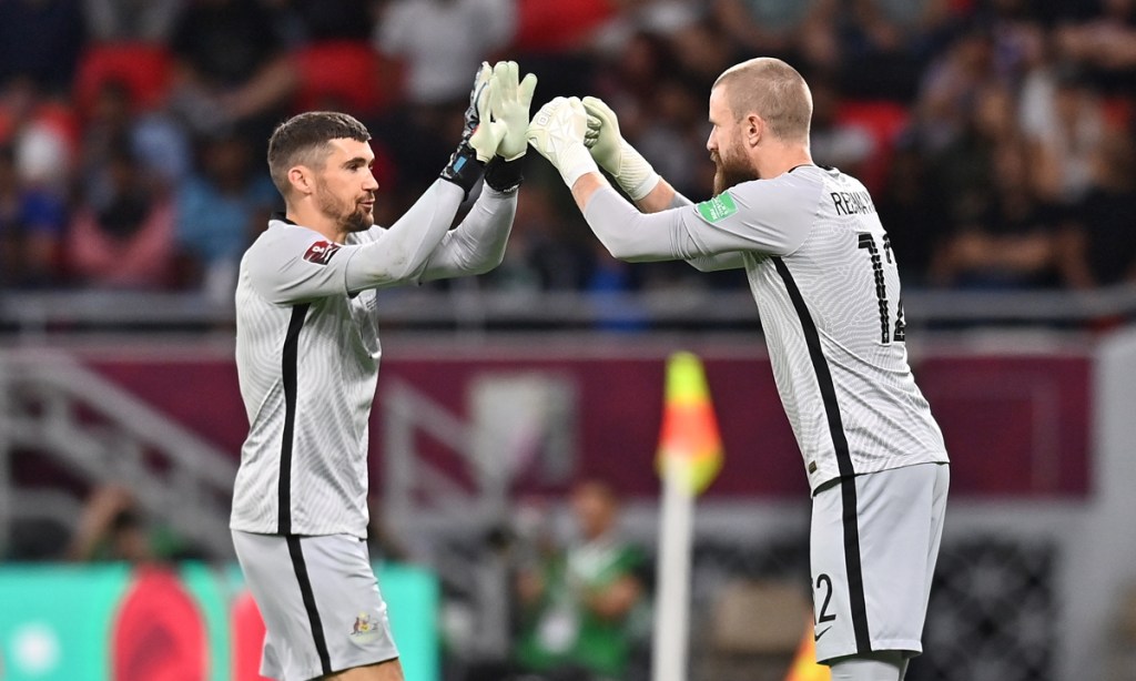Australia's goalkeeper and captain Mathew Ryan (left) is replaced by teammate Andrew Redmayne for the penalty shootout against Peru. Photo: Noushad Thekkayil/EPA
