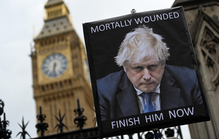 A billboard outside the British parliament before Boris Johnson's resignation this month.  Photo: Andy Rain/EPA