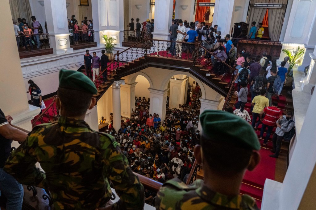Protesters invade former Sri Lanka President Gotabaya Rajapaksa’s Colombo residence last week. Photo: AP/Rafiq Maqbool