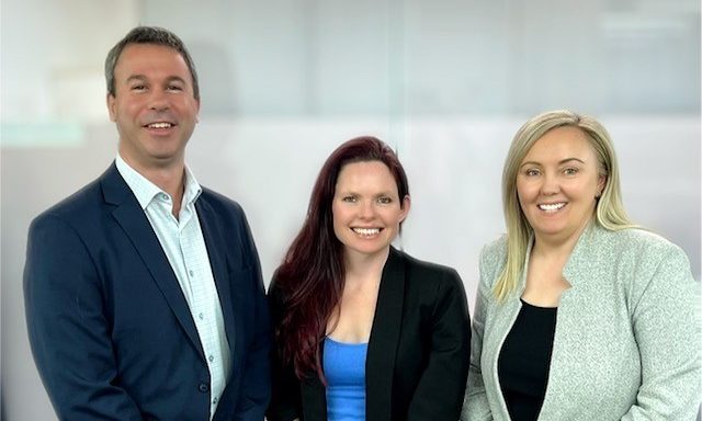 Micheal Rapisarda (left) has joined wife Paula Rapisarda (right) at MGA Insurance Group. Morgan Stuckey (centre) has also earned a promotion to Portfolio Manager. Photo: supplied