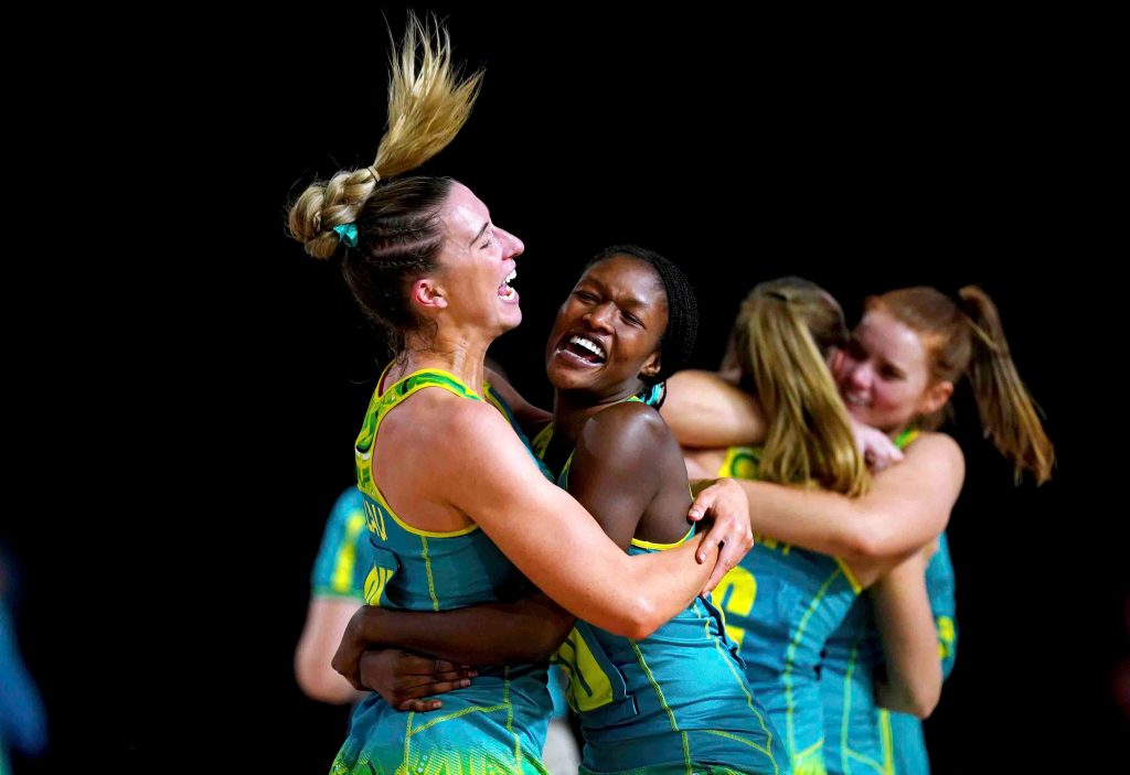 Australia's Sarah Klau, left, and Sunday Aryang celebrate after winning the gold medal match against Jamaica. Photo: Mike Egerton//PA via AP