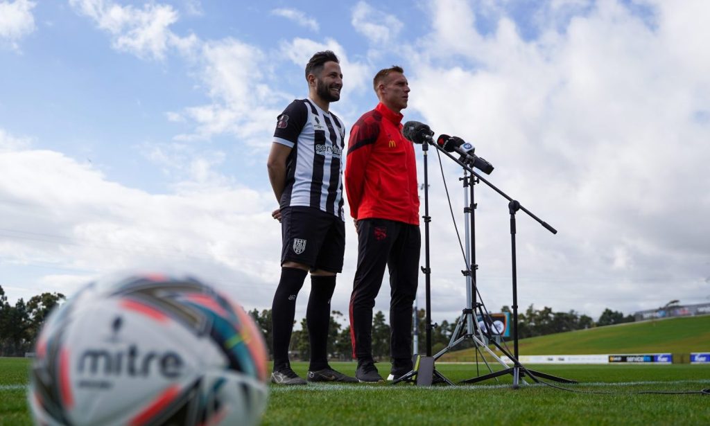  Adelaide City's Nicholas Bucco and Adelaide United's Lachlan Barr. Photo: Adelaide United