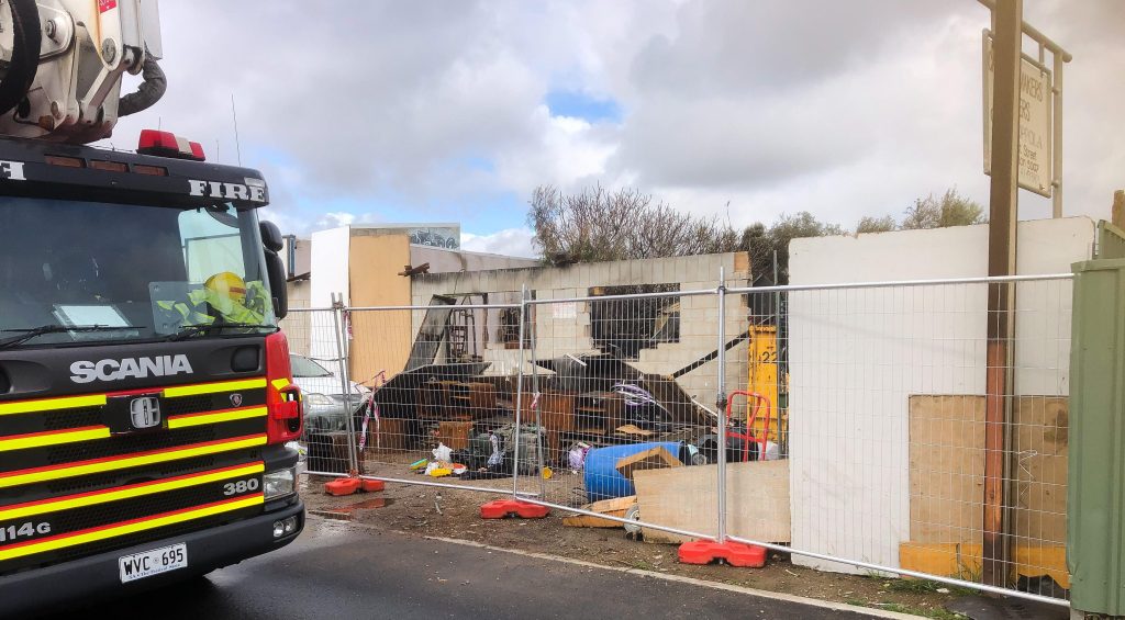 Fire investigators attend the gutted Brompton building on Monday. Photo supplied.