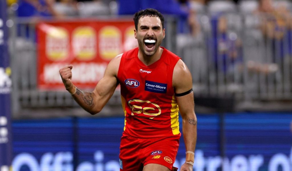 Izak Rankine celebrates a goal for the Suns in March. Photo: AAP/Richard Wainwright