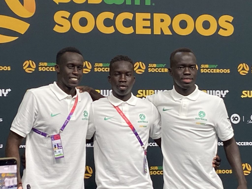 Socceroos Thomas Deng, Garang Kuol and Awer Mabil in Qatar on Friday. Photo: AAP/Steve Larkin