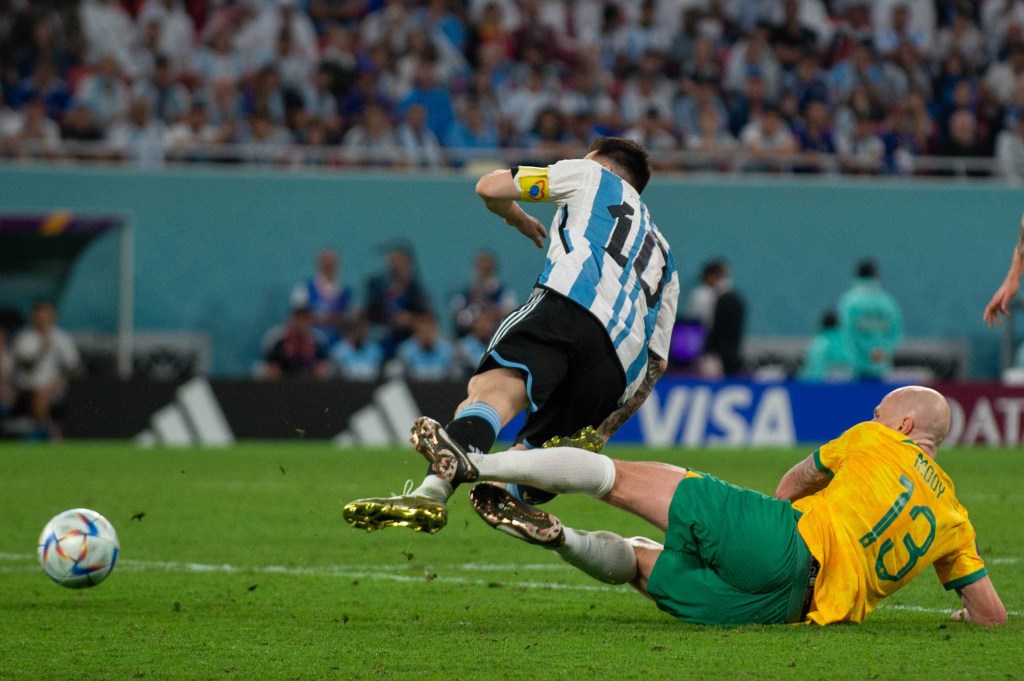 Aaron Mooy fouls Lionel Messi in the round 16 match on the weekend. The Socceroos made a habit of making life difficult for more-fancied opponents. Photo: Andrew Surma/ SIPA