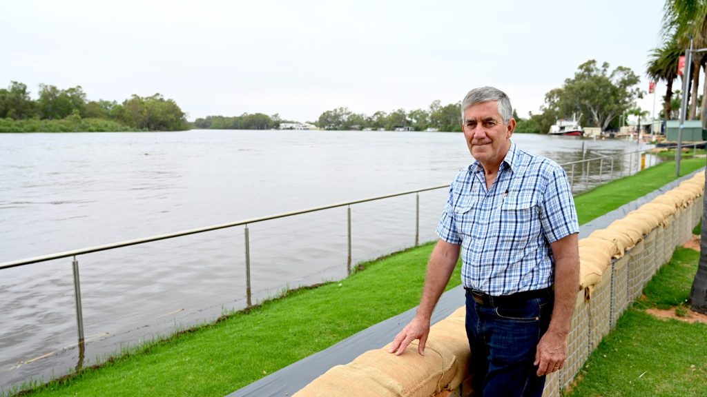 Renmark Mayor Peter Hunter inspects barriers which protected the town from River Murray flooding. He's now calling for urgent mental health services to help struggling locals. Photo: Belinda Willis