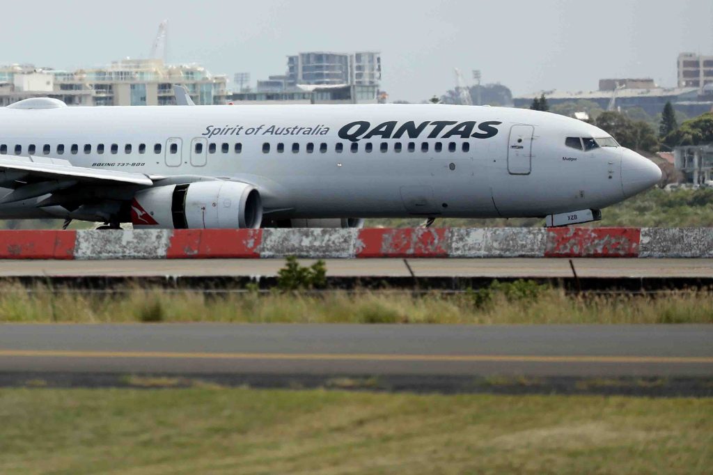 QF144 lands at Sydney International Airport in Sydney. Photo: AAP/Jeremy Ng