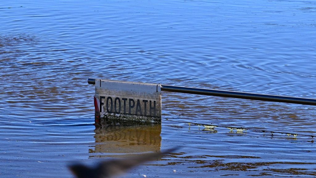 Thumbnail for Flood peak threatens highway as hopeful signs emerge upstream
