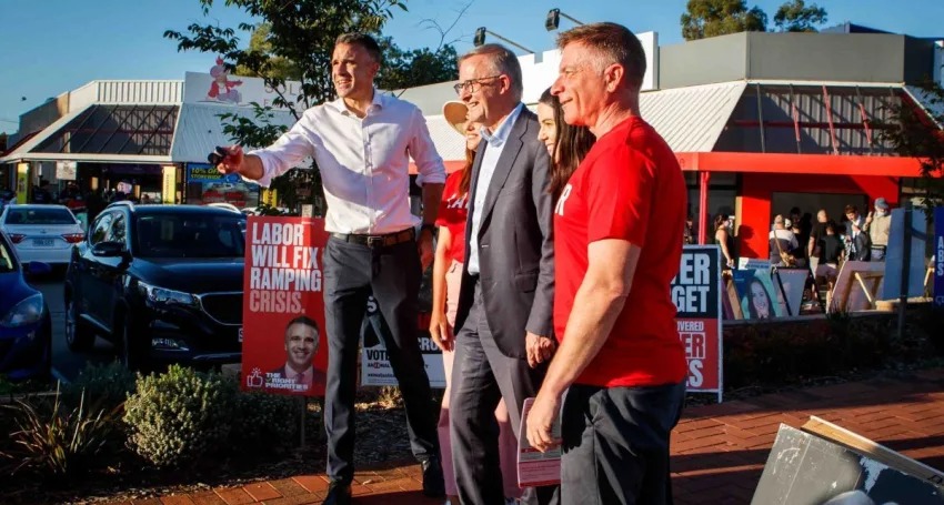 Peter Malinauskas with now Prime Minister Anthony Albanese and Labor candidates during a visit to a pre-polling booth ahead of the 2022 state election. Photo: Matt Turner/AAP