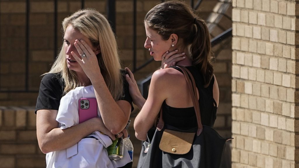 Women speak at the reunification center at the Woodmont Baptist church following a school shooting in Nashville, US. Photo: John Bazemore/AP  
