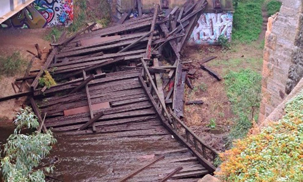 The 1876-built Angle Vale Bridge has collapsed into the Gawler River. Photo: Light Regional Council