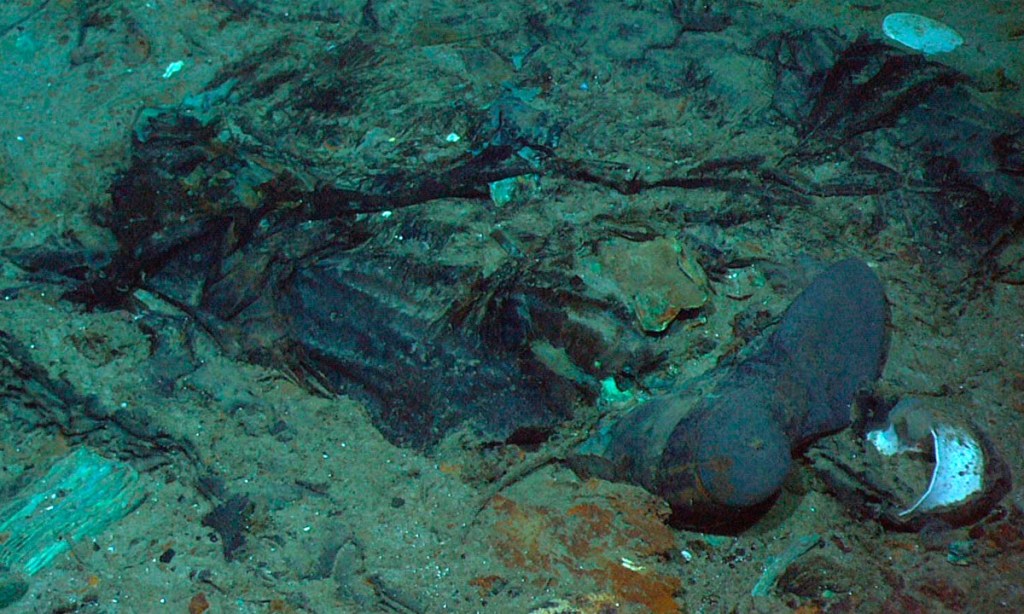 This 2004 photo provided by the Institute for Exploration, Center for Archaeological Oceanography/University of Rhode Island/NOAA Office of Ocean Exploration, shows the remains of a coat and boots in the mud on the sea bed near the Titanic's stern. Photo: AAP