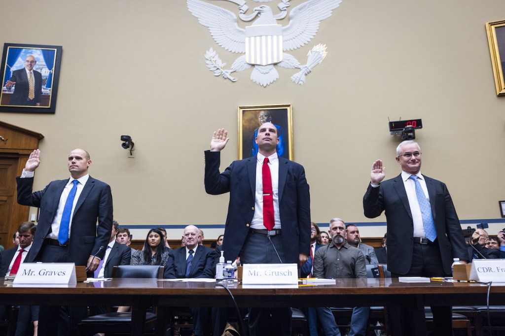 David Grusch (centre) testified to Congress. Photo: EPA/JIM LO SCALZO