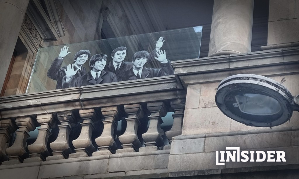 An estimated 30,000 people gathered on King William St to greet the Beatles at Town Hall in 1964. The moment was commemorated with this piece of glass artwork in 2016. Photo: InDaily