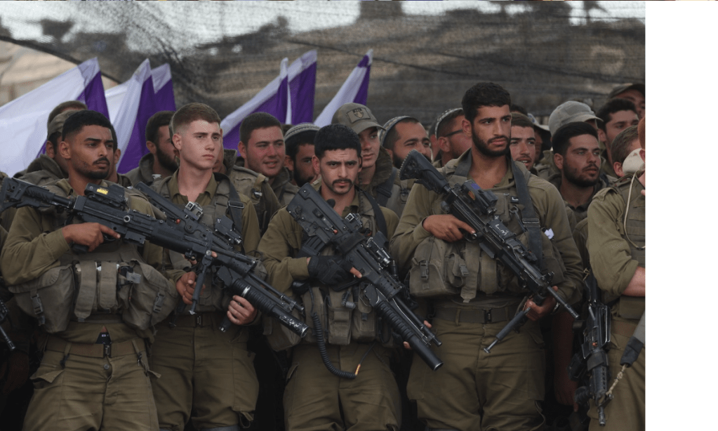 Israeli soldiers on the Gaza border. Photo: Abir Sultan/EBA