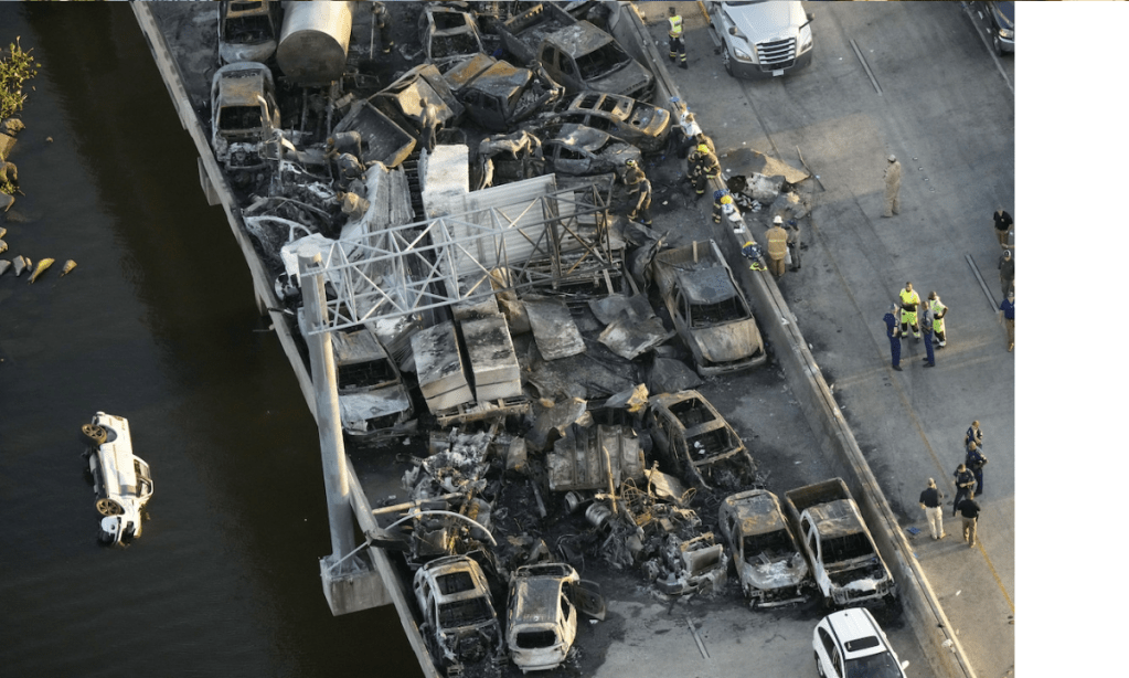 Burned cars and trucks on a freeway bridge after one of multiple pileups in Louisiana. Photo: Gerald Herbert/AP