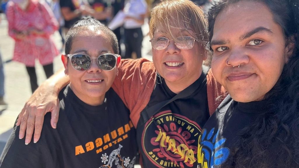 Wearing Yes to the Voice t-shirts in Aboriginal languages. From left: Violet Buckskin, Colleen-Ara Palka Strangways and Keisha Jackson. Photo: supplied
