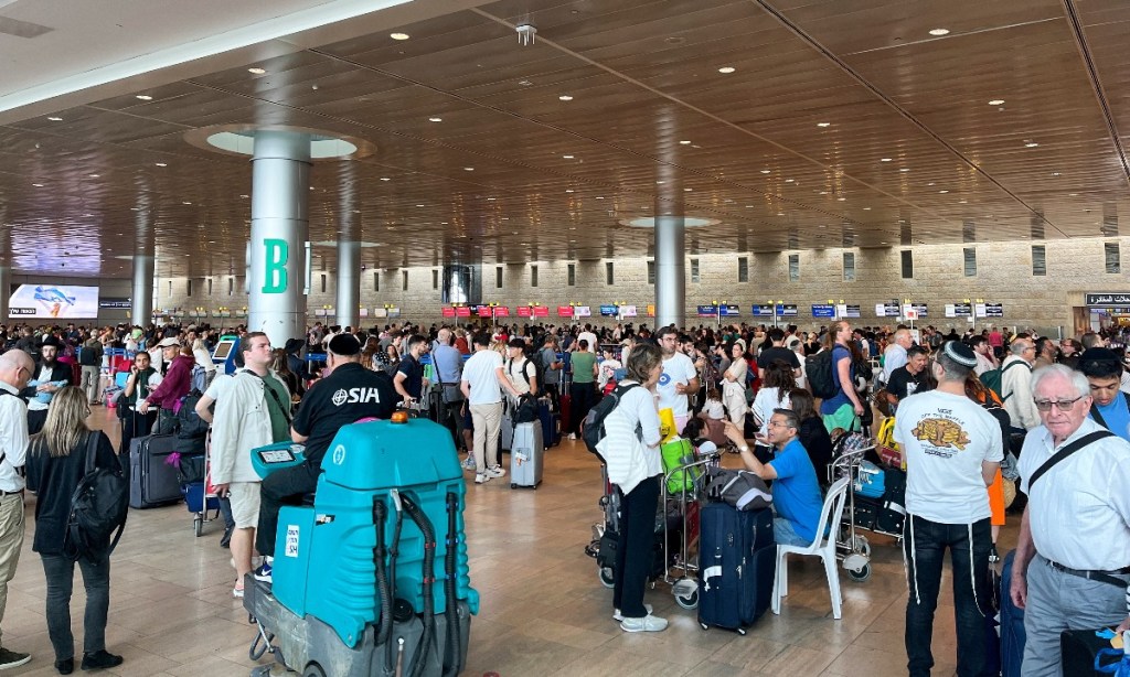 Travellers at Israel's main airport, Ben Gurion International Airport, amid an escalation of the Israeli-Palestinian conflict. Photo: TASS/Sipa USA