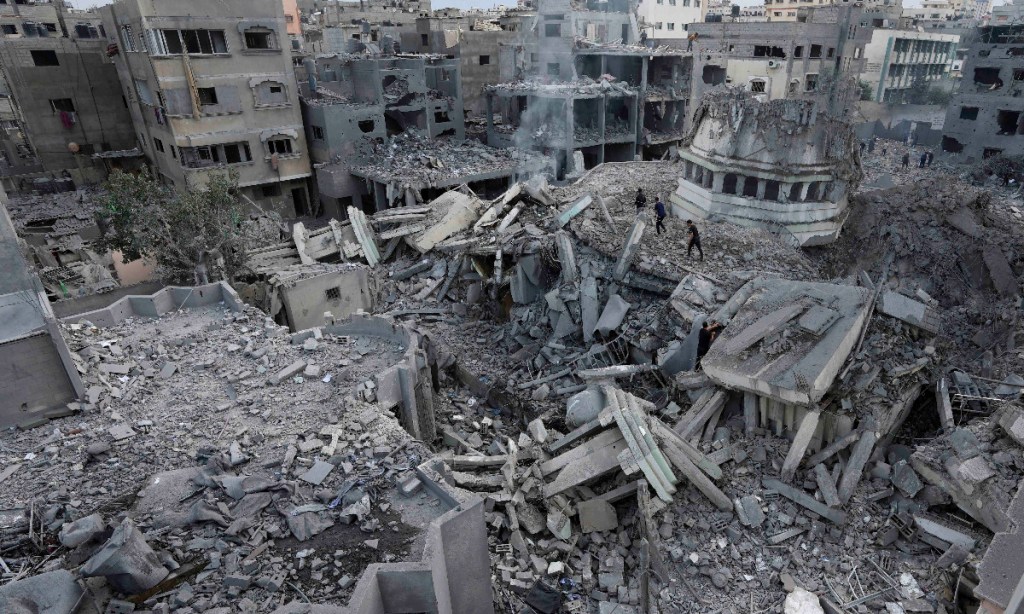 Israeli strikes have destroyed buildings in Gaza as officials said the area would pay a heavy price. Photo: EPA