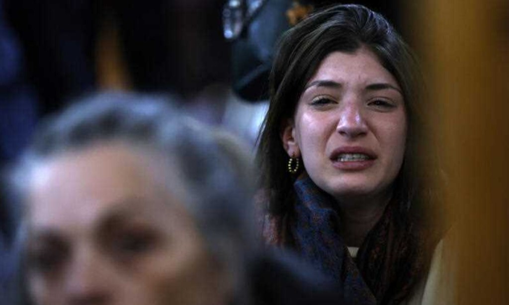 A woman is seen during a vigil for the victims of the recent attacks in Israel, at the Caulfield Shule, Melbourne on Monday. Photo: AAP Image/Con Chronis