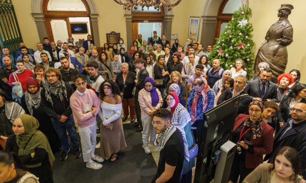 Palestinian advocates in the Town Hall foyer prior to a council debate on whether to light flag in Palestinian colours. Photo: Tony Lewis/InDaily