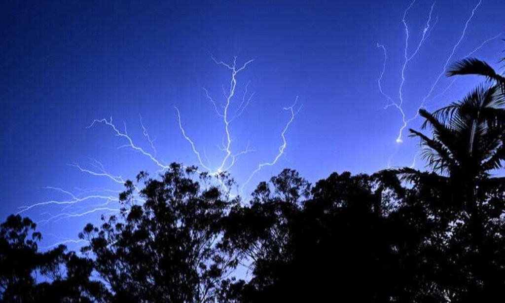 An electrical storm is seen at Reedy Creek on the Gold Coast Monday. Photo: AAP/Dave Hunt