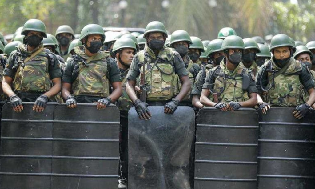 Armed soldiers in Sri Lanka block a road during protests over tax reforms in January 2023. Tensions have not eased across the nation and it's a flash point to watch in 2024. Photo: EPA/Chamalia Karunarathne