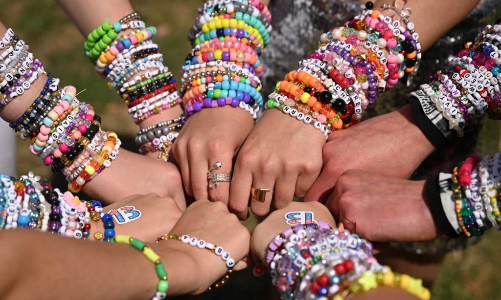 Taylor Swift fans show off their friendship bracelets ahead of the singer songwriter's first Eras tour concert at the MCG. Photo: AAP/Joel Carrett