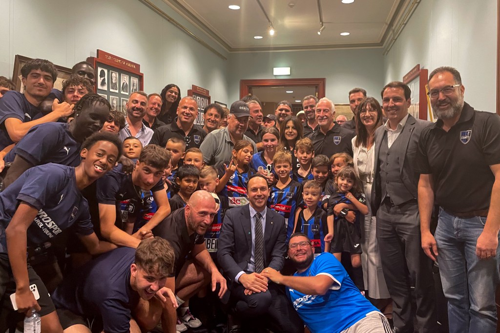 The Adelaide Comets with Councillors Arman Abrahimzadeh, Mary Couros and Henry Davis after their Council win. This picture: Helen Karakulak 