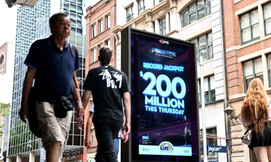 Thumbnail for Hysterical laughter, ‘endless options’: Powerball couple take call in bed