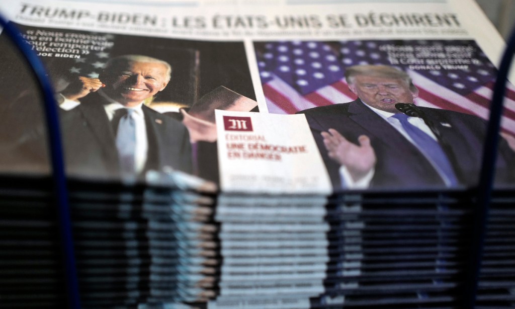 A stack of the French newspaper Le Monde on a newsstand in Paris. Photo: Francois Mori/AP