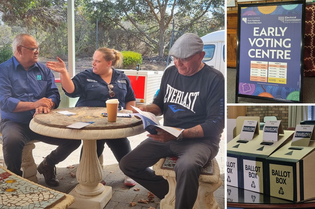 Voice candidate Jack Johncock (left) speaks to an Electoral Commission staff member at a voting information centre in Port Lincoln. Johncock has hailed the South Australian Voice as a "second chance" for Aboriginal people. Photo: Thomas Kelsall/InDaily