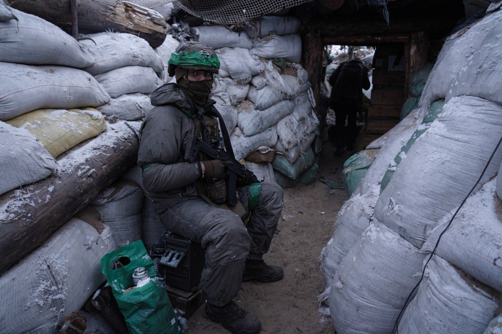A Ukrainian soldier rests in a trench in the Donetsk region. With a lack of ammunition and military personnel, Ukraine is having a hard time on its frontline as the war between Ukraine and Russia continues. Photo by Ashley Chan / SOPA Images/Sipa USA