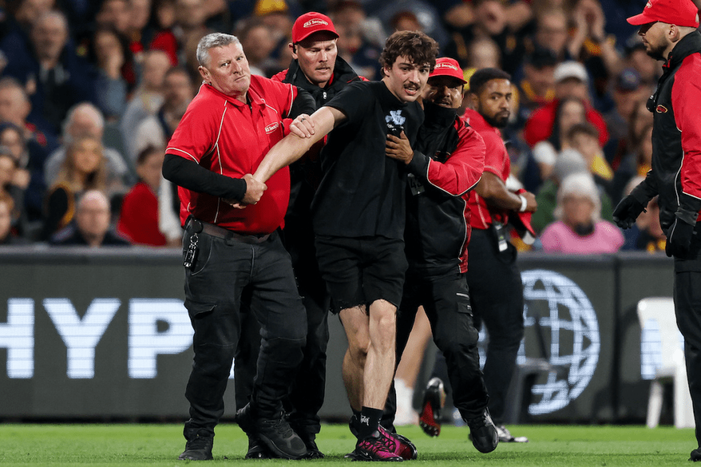 The AFL has given a lifetime ban from attending games to a man who ran on to Adelaide Oval during a Crows-Geelong clash in March. Photo: Matt Turner/AAP