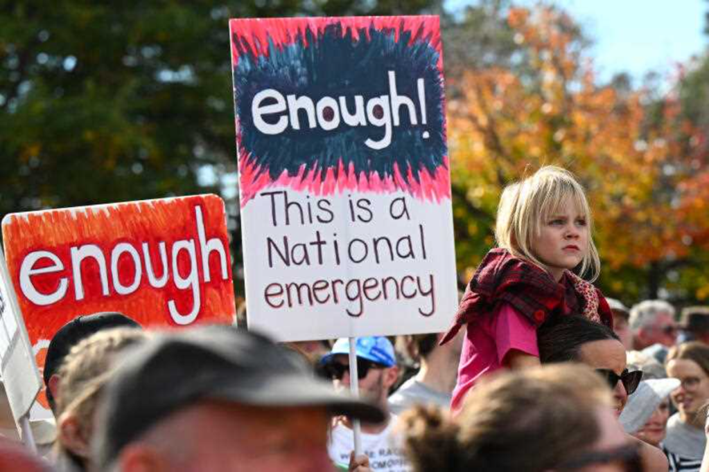 A girl attends a rally to a call for action to end violence against women, in Canberra on Sunday, April 28. Photo: AAP Image/Lukas Coch
