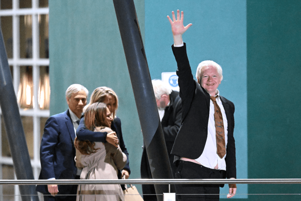 Julian Assange arrives at Canberra Airport on Wednesday night. Photo: Lukas Coch: EPA/AAP