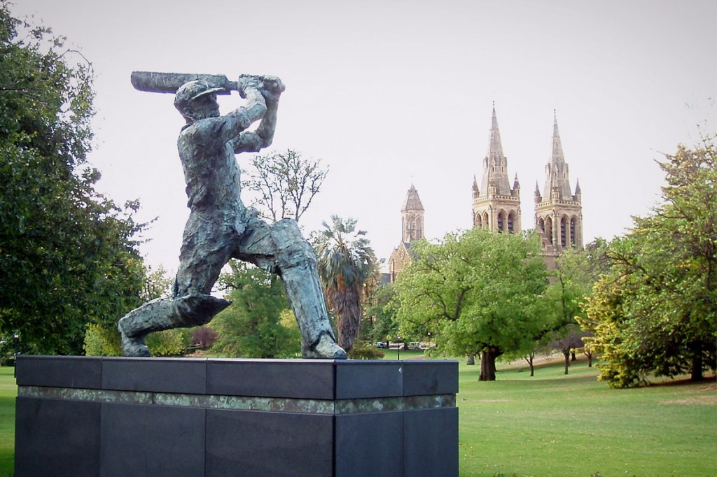Don Bradman is immortalised in bronze outside Adelaide Oval. Photo: Wikimedia Commons