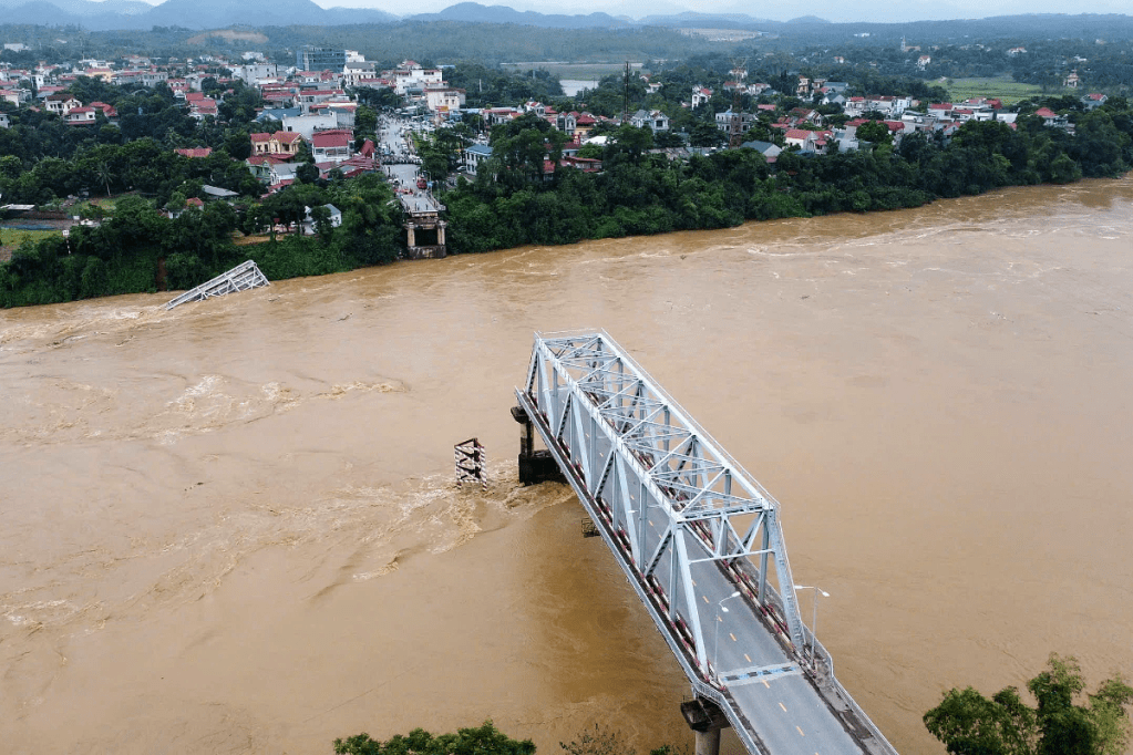 Thumbnail for Bridge and vehicles plunge into river as Vietnam typhoon death toll rises