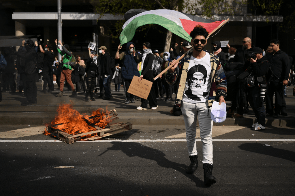 A protester outside the Land Forces exposition in Melbourne on Tuesday. Photo: AAP
