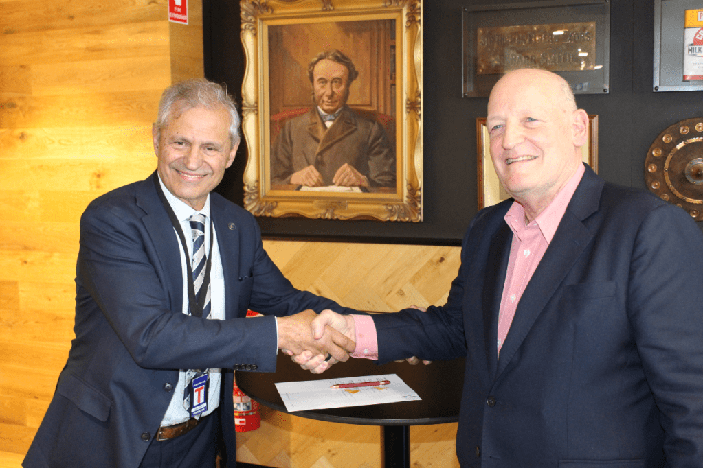 SmartSat CEO Professor Andy Koronios and Elders CEO and managing director Mark Allison sign the MoU. Photo: David Simmons / InDaily 