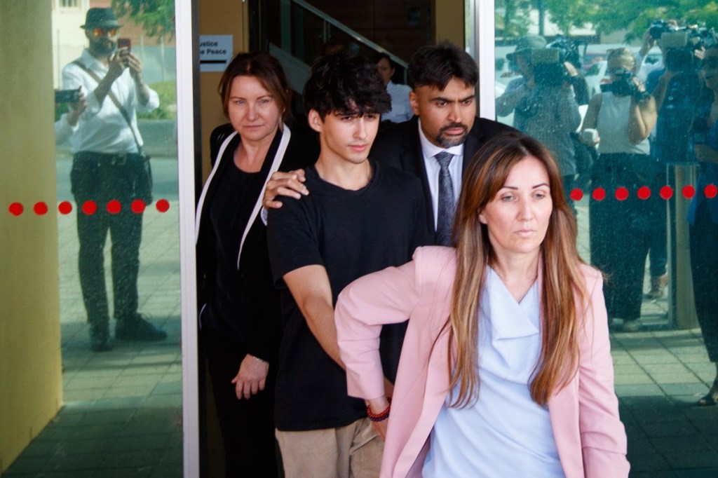 Dhirren Randhawa leaves court led by his mother Amreeta Stara, at the Christies Beach Magistrates Court in Adelaide, Monday, November 20, 2023. Photo: AAP Image/Matt Turner