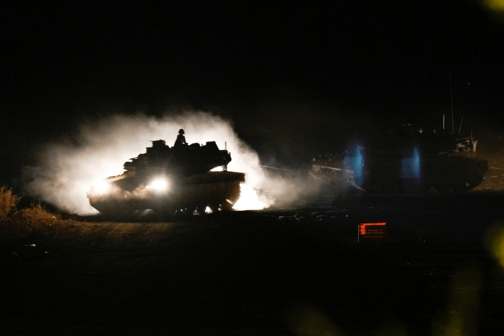 An Israeli tank manoeuvres in northern Israel near the Israel-Lebanon border on Monday. Photo: AP